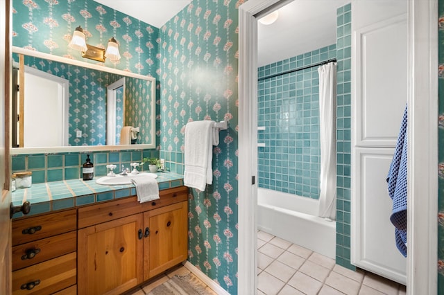 bathroom featuring shower / bath combination with curtain, tile patterned floors, and vanity