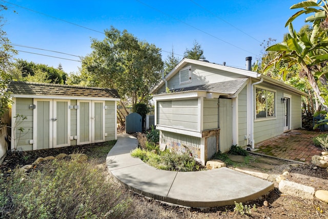 exterior space with a storage shed