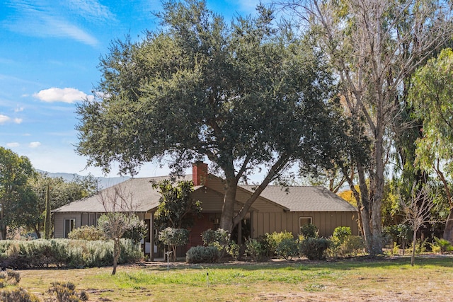 view of property exterior featuring a lawn