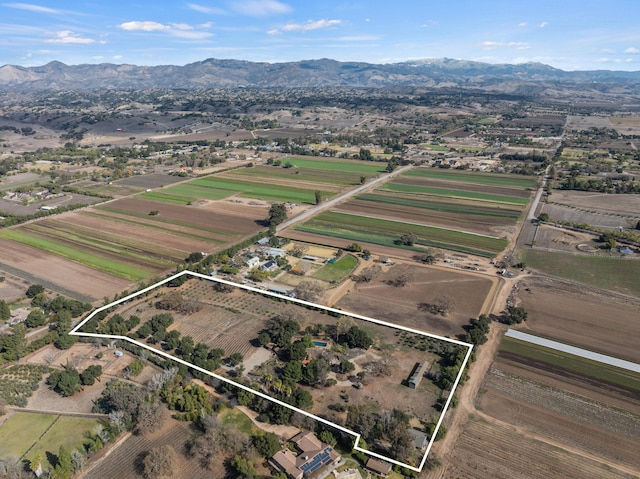 drone / aerial view with a mountain view and a rural view