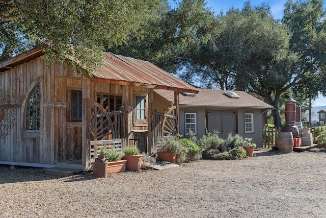 view of front facade with an outbuilding