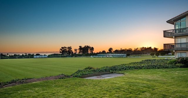 view of community featuring a water view and a lawn