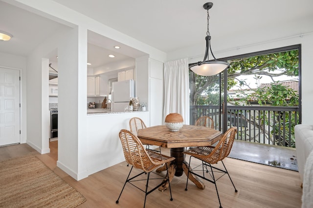 dining space featuring light hardwood / wood-style floors