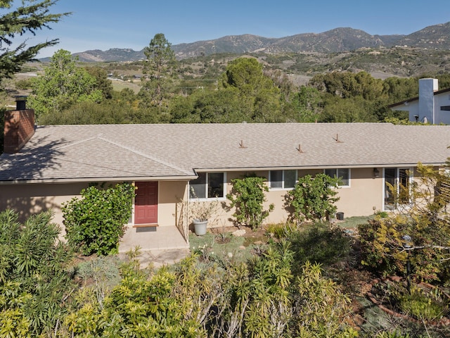 ranch-style home with a mountain view