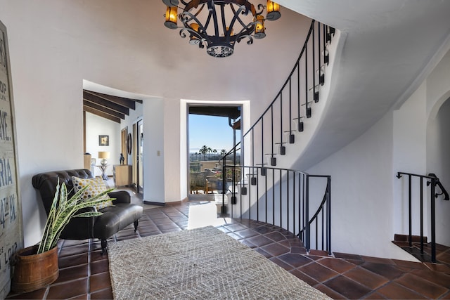 foyer entrance with dark tile patterned flooring