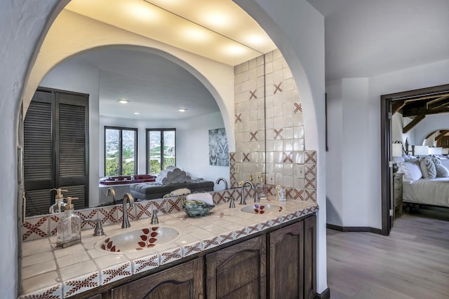 bathroom with wood-type flooring and vanity