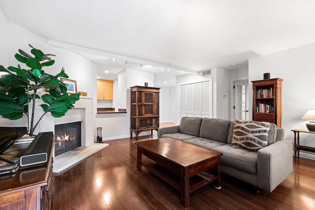 living room featuring dark wood-type flooring