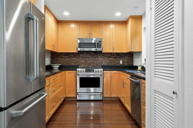 kitchen with sink, appliances with stainless steel finishes, backsplash, dark hardwood / wood-style flooring, and light brown cabinets