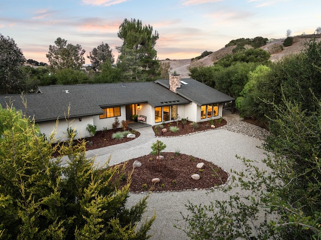 view of front of property with a mountain view