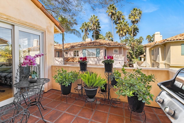 view of patio featuring a grill