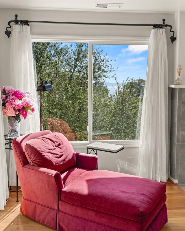 sitting room with hardwood / wood-style flooring