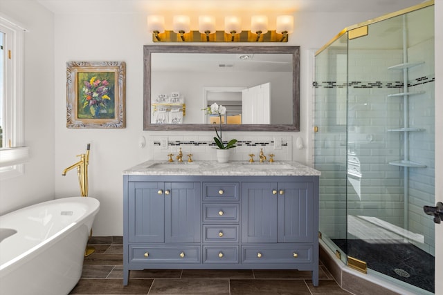 bathroom with vanity, separate shower and tub, and backsplash