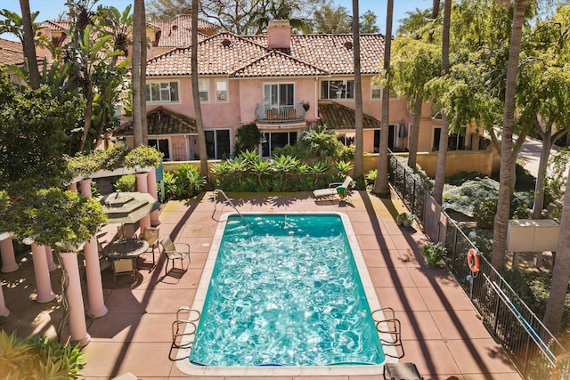 view of swimming pool with a patio