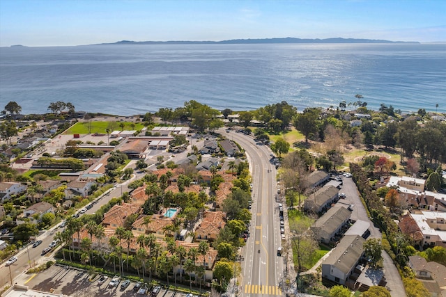 birds eye view of property with a water and mountain view