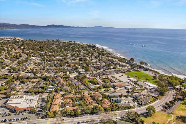 drone / aerial view with a water and mountain view