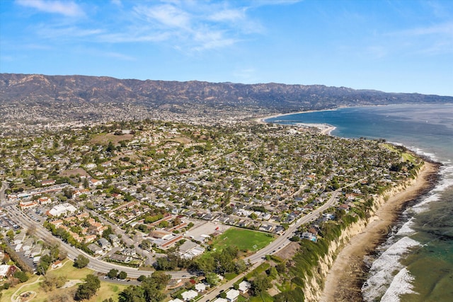 drone / aerial view featuring a water and mountain view