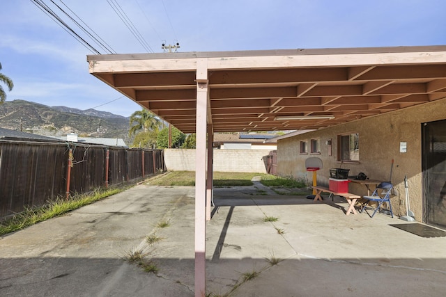 view of patio / terrace featuring a mountain view