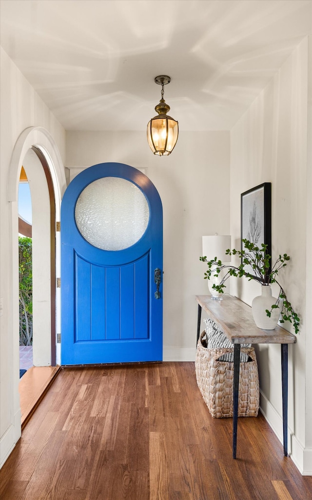 foyer with dark hardwood / wood-style floors