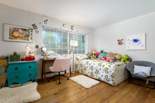 bedroom with wood-type flooring