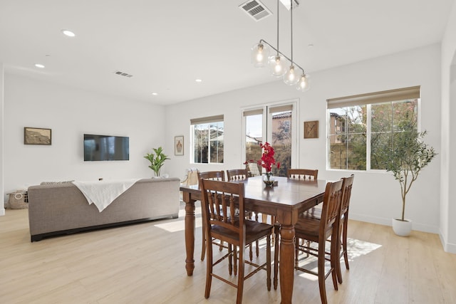 dining space featuring light hardwood / wood-style floors