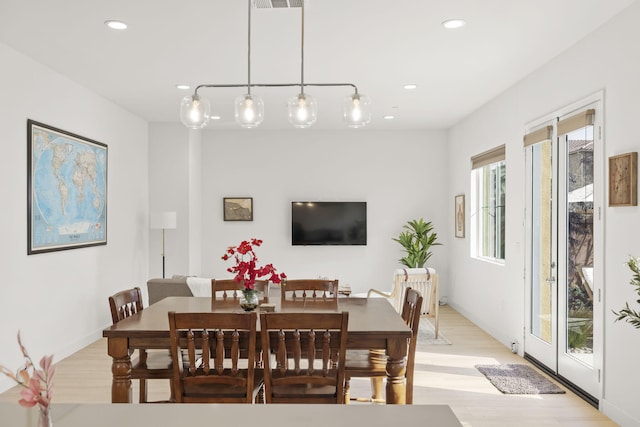 dining area featuring light wood-type flooring