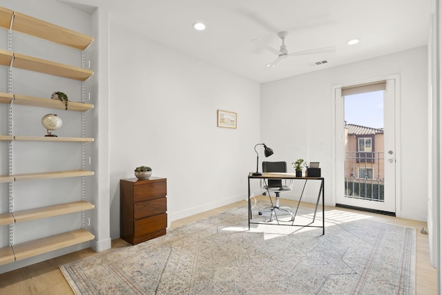 office area with ceiling fan and light hardwood / wood-style flooring