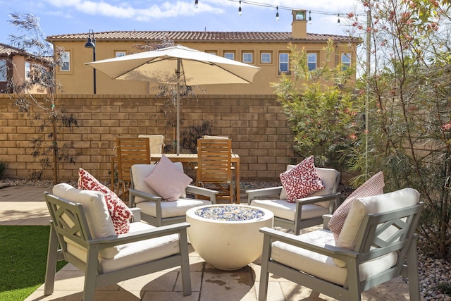 view of patio with an outdoor fire pit