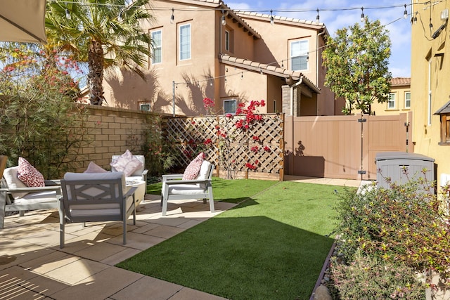 view of yard featuring an outdoor living space and a patio area