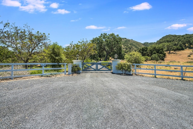 view of gate featuring a rural view