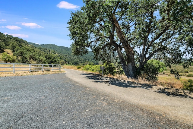 view of street featuring a mountain view and a rural view