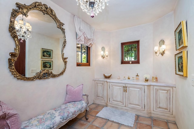 bathroom featuring vanity and a chandelier