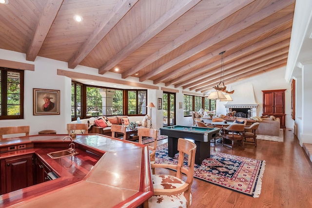 playroom with sink, light hardwood / wood-style flooring, lofted ceiling with beams, pool table, and wooden ceiling