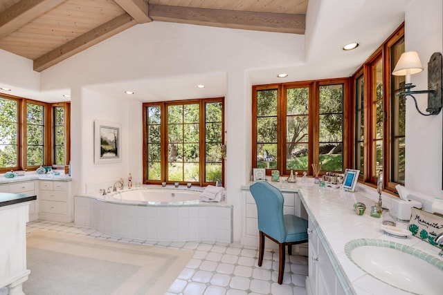 bathroom with a relaxing tiled tub, vanity, lofted ceiling with beams, and wooden ceiling