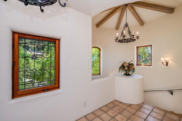 interior space featuring beamed ceiling, a chandelier, and a wealth of natural light