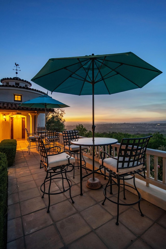 view of patio terrace at dusk