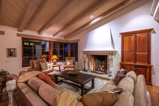 living room featuring wood-type flooring, vaulted ceiling with beams, wood ceiling, and a fireplace