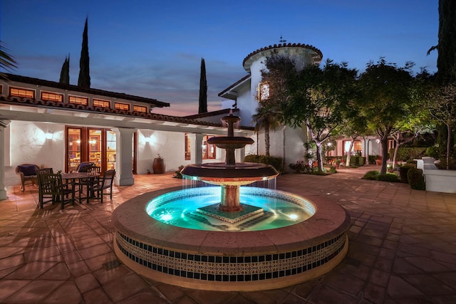 view of patio terrace at dusk