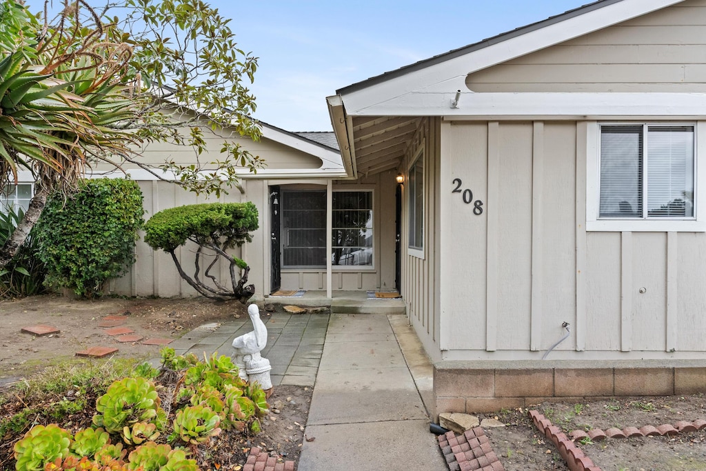 entrance to property with a patio