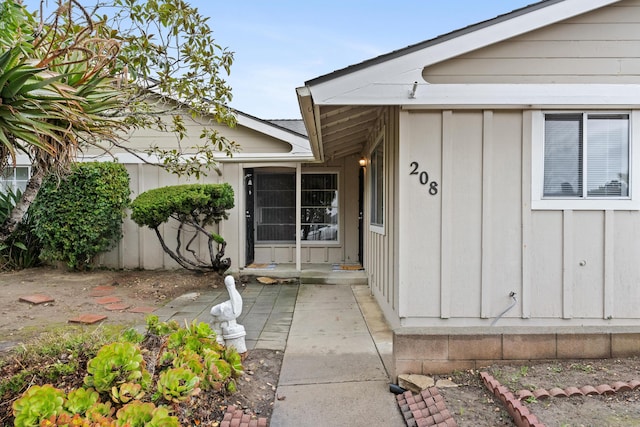 entrance to property with a patio