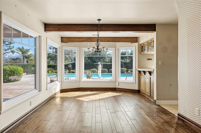 2385 Janin Pl, Solvang, CA 93463 - unfurnished sunroom featuring a notable chandelier, beam ceiling, and a wealth of natural light