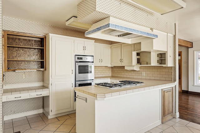 2385 Janin Pl, Solvang, CA 93463 - kitchen featuring tasteful backsplash, light tile patterned floors, tile countertops, and appliances with stainless steel finishes