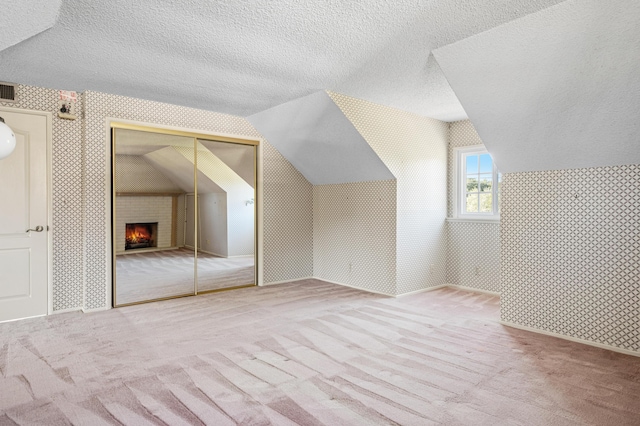 2385 Janin Pl, Solvang, CA 93463 - additional living space featuring carpet flooring, vaulted ceiling, and a textured ceiling