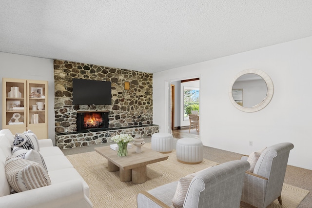 2385 Janin Pl, Solvang, CA 93463 - carpeted living room featuring a textured ceiling and a fireplace