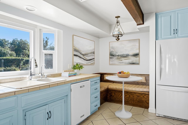 2385 Janin Pl, Solvang, CA 93463 - kitchen featuring sink, white appliances, light tile patterned floors, hanging light fixtures, and tile countertops