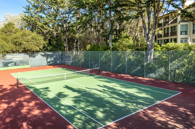 view of sport court with basketball hoop