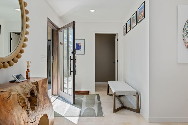 doorway featuring light tile patterned floors