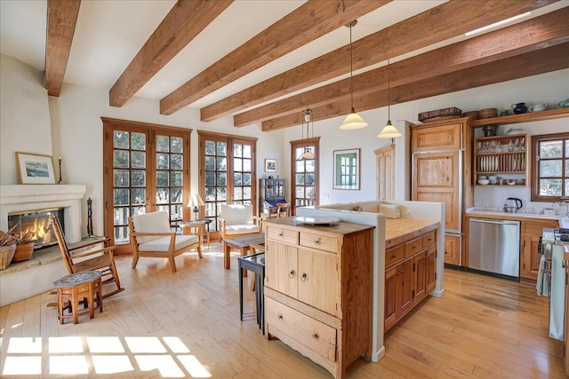 kitchen featuring french doors, a center island, light hardwood / wood-style flooring, dishwasher, and pendant lighting