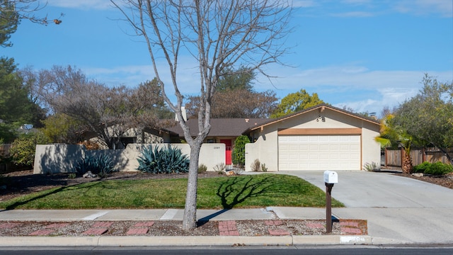 ranch-style house featuring a front lawn and a garage