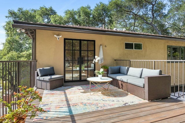 wooden deck featuring an outdoor hangout area and french doors