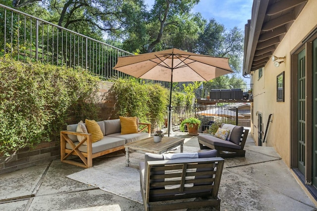 view of patio featuring a fenced backyard and outdoor lounge area